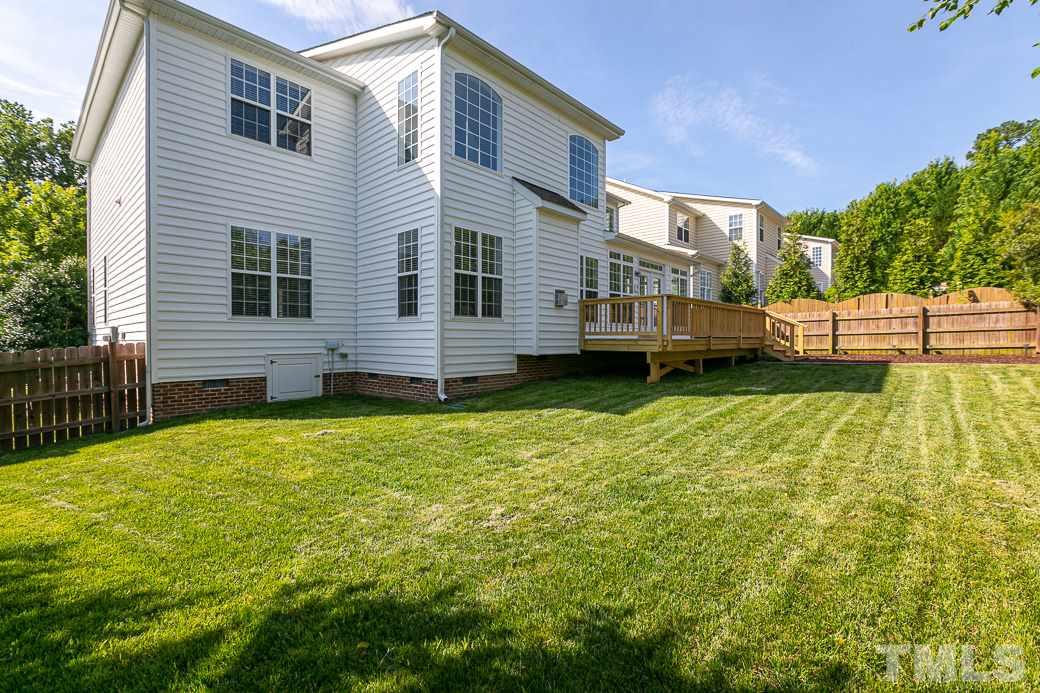 108 Quarryrock Road Holly Springs, NC 27540 - Photo 26 of 30 a view of a house with a backyard