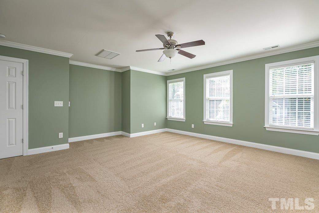 108 Quarryrock Road Holly Springs, NC 27540 - Photo 8 of 30 a view of an empty room with a window