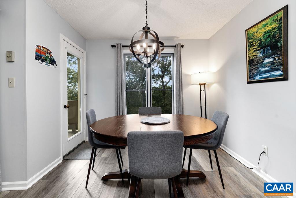 2056 Stone Ridge Roseland, VA 22967 - Photo 11 of 24 a view of a dining room with furniture window and wooden floor