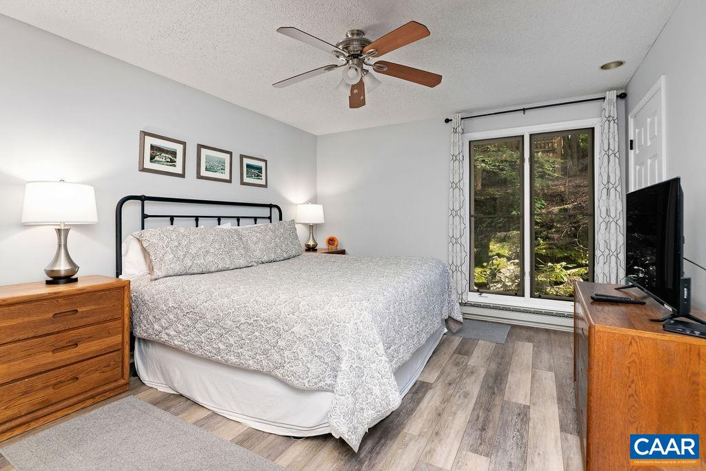 2056 Stone Ridge Roseland, VA 22967 - Photo 18 of 24 a bedroom with a bed and a flat screen tv