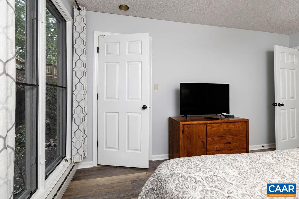 2056 Stone Ridge Roseland, VA 22967 - Photo 20 of 24 a bedroom with a bed and a flat screen tv