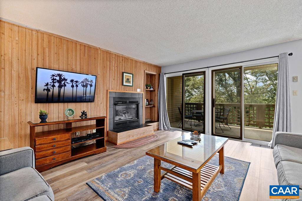 2056 Stone Ridge Roseland, VA 22967 - Photo 6 of 24 a living room with furniture a large window and a flat screen tv