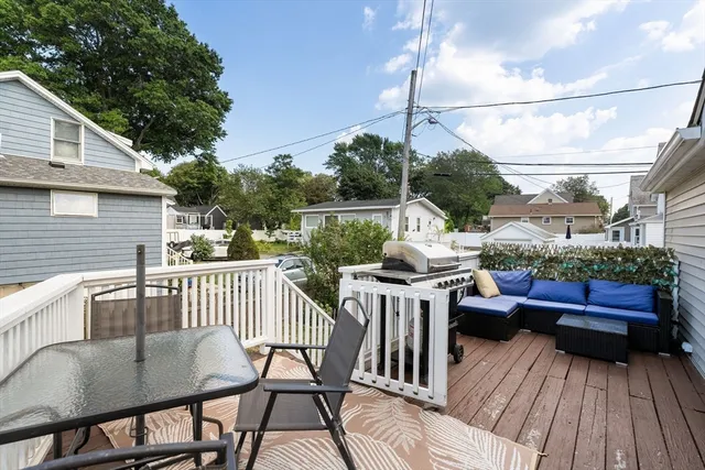a view of a chairs and table on the balcony