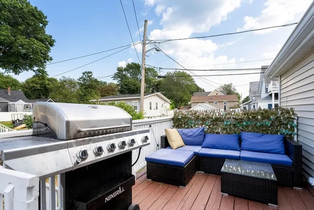 a view of a patio with couches chairs and a fire pit