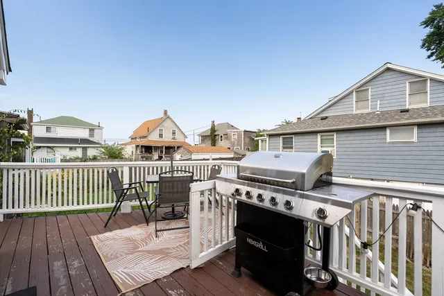 a view of a deck with wooden floor and fence