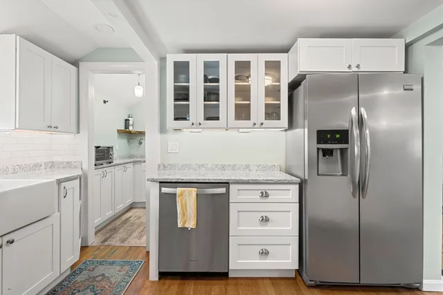 a kitchen with cabinets and stainless steel appliances