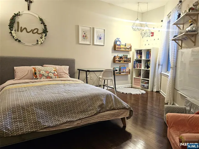 a bedroom with a bed and a chair