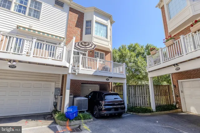 a view of a car park in front of house