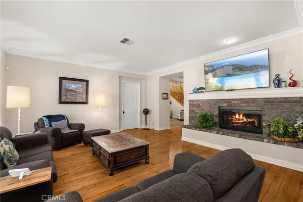 a kitchen with stainless steel appliances granite countertop a stove refrigerator and a sink
