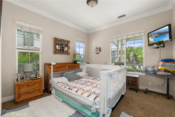 a living room with furniture a rug and a window