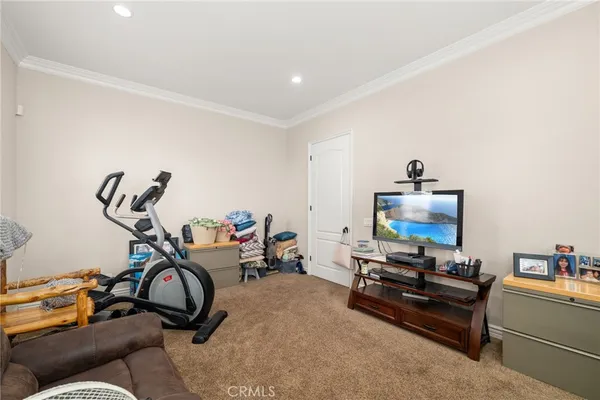 a bedroom with a bed and cabinets