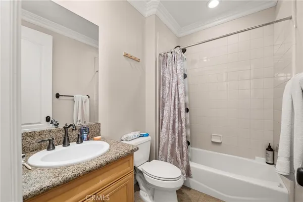 a view of a balcony with floor to ceiling window and wooden fence