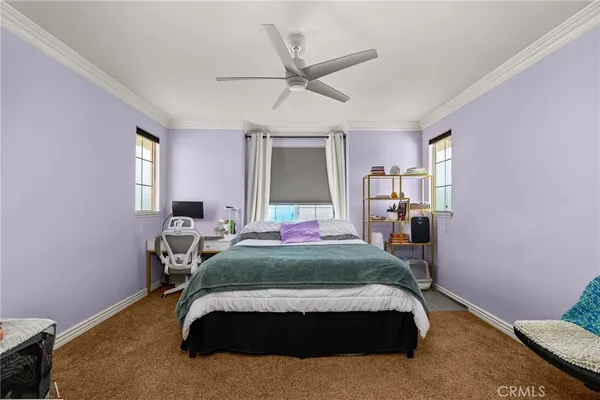 a view of a balcony with floor to ceiling window and wooden fence