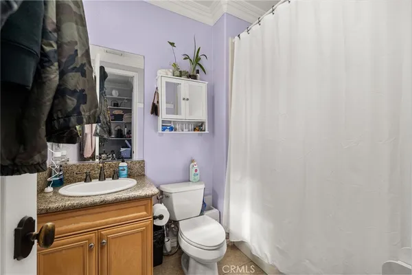 an aerial view of residential building with outdoor space and ocean view