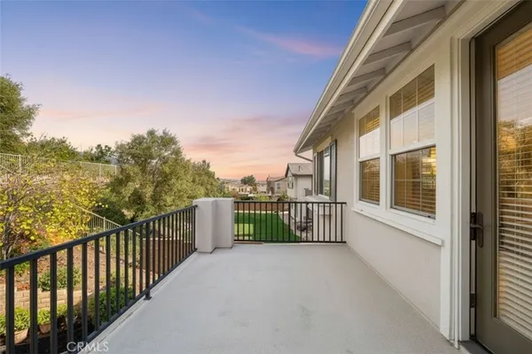 a view of a garden with a building in the background