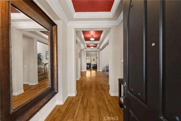 a living room with furniture a fireplace and a large window