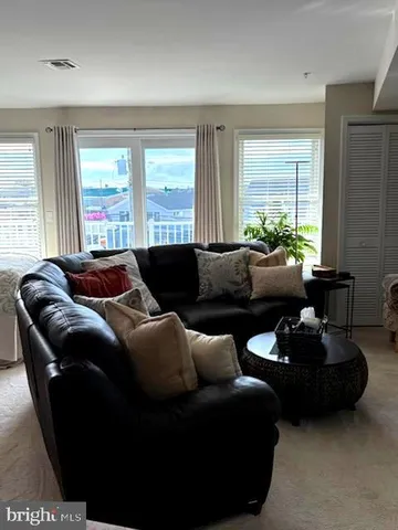 a living room with furniture and windows