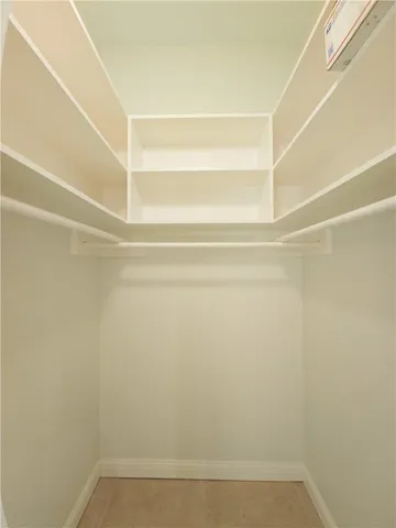 a view of an empty room with a fan