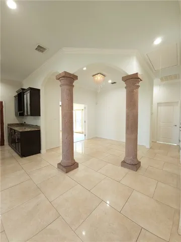 a kitchen with granite countertop a refrigerator and a stove