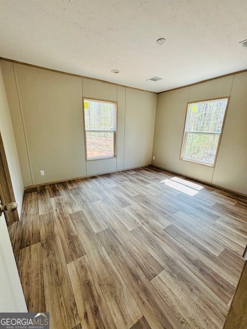 169 Lakeside Trail Martin, GA 30557 - Photo 9 of 19 an empty room with wooden floor and windows