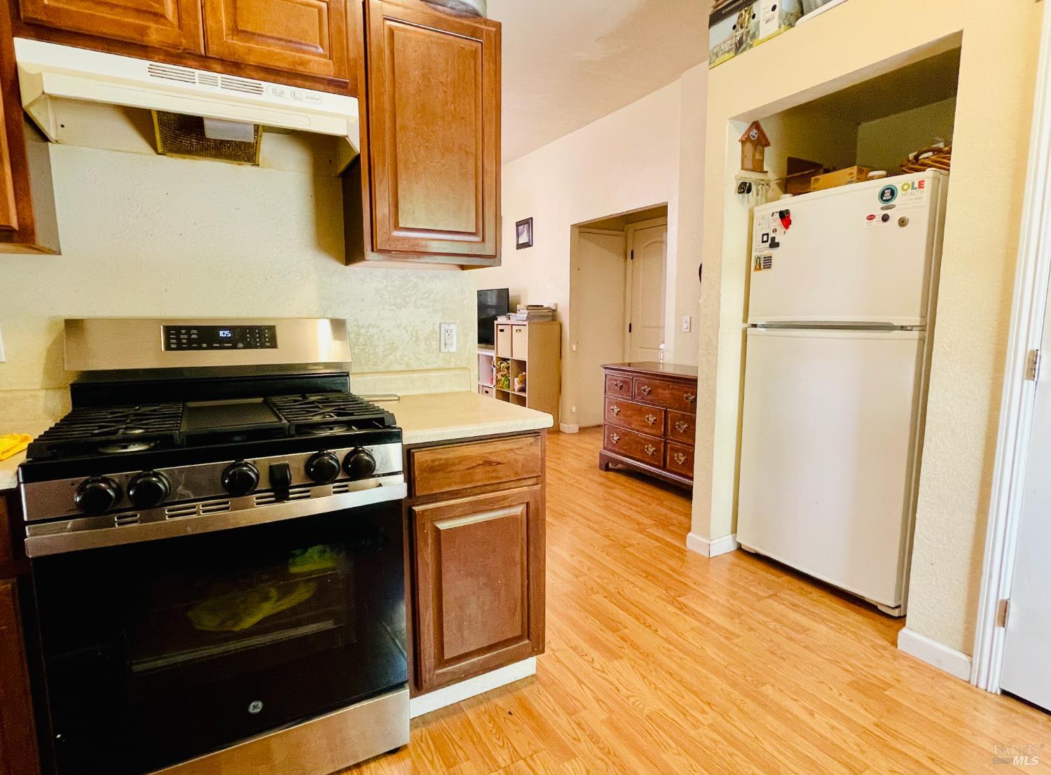918 Napa Street Napa, CA 94559 - Photo 12 of 18 a kitchen with a stove and white cabinets
