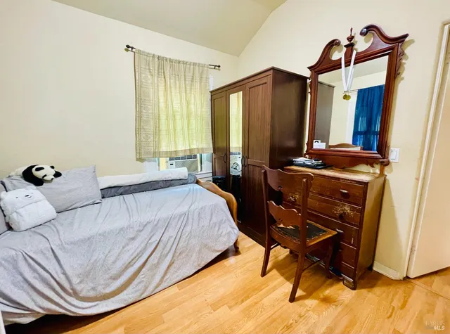 a bedroom with a bed and a dresser