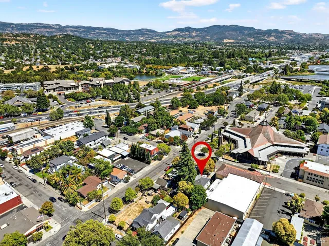 an aerial view of residential building with parking