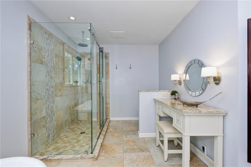130 West Cruikshank Road Butler, PA 16002 - Photo 17 of 25 Frameless walk-in shower with Rainshower head & a separate vanity area! Beautiful detailing. There is also a built in jewelry center on the wall just out of view in this picture.