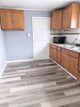 a bathroom with a sink and cabinets