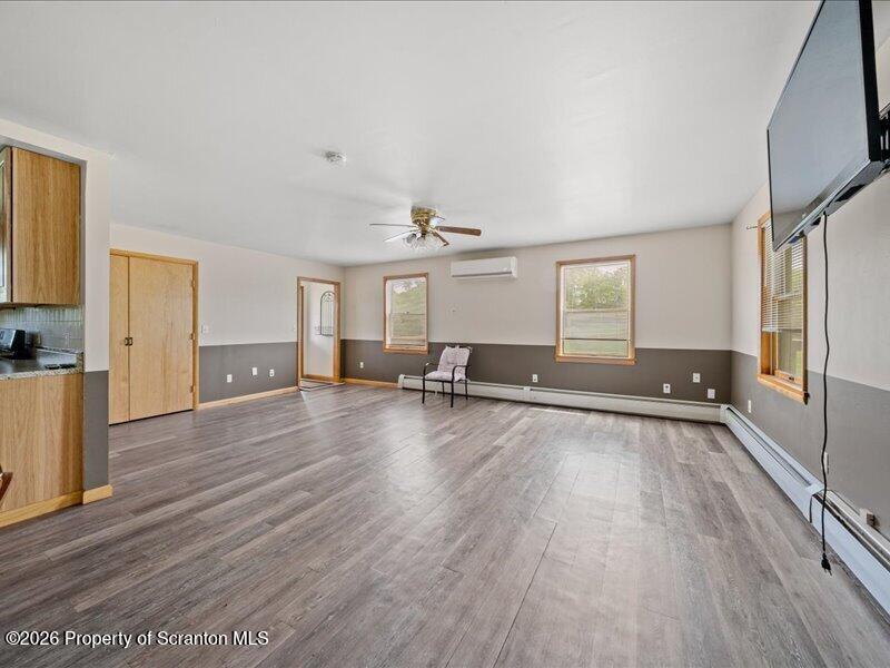 9-17 Vago Road Tunkhannock, PA 18657 - Photo 13 of 57 a view of a livingroom with wooden floor and staircase