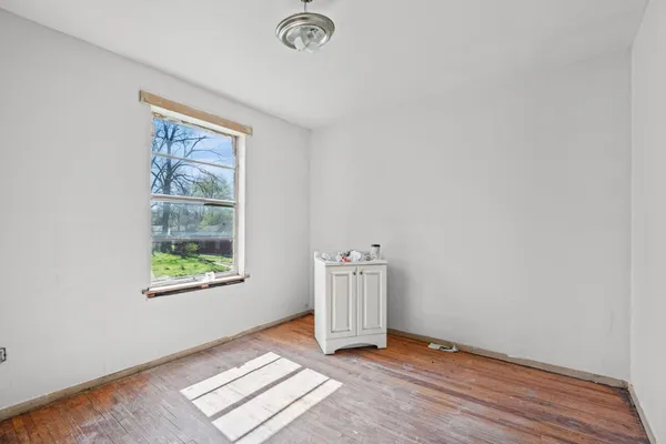 a bathroom with a bathtub and a window