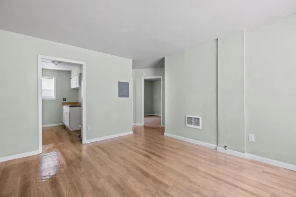 a view of livingroom with hardwood floor and a sink