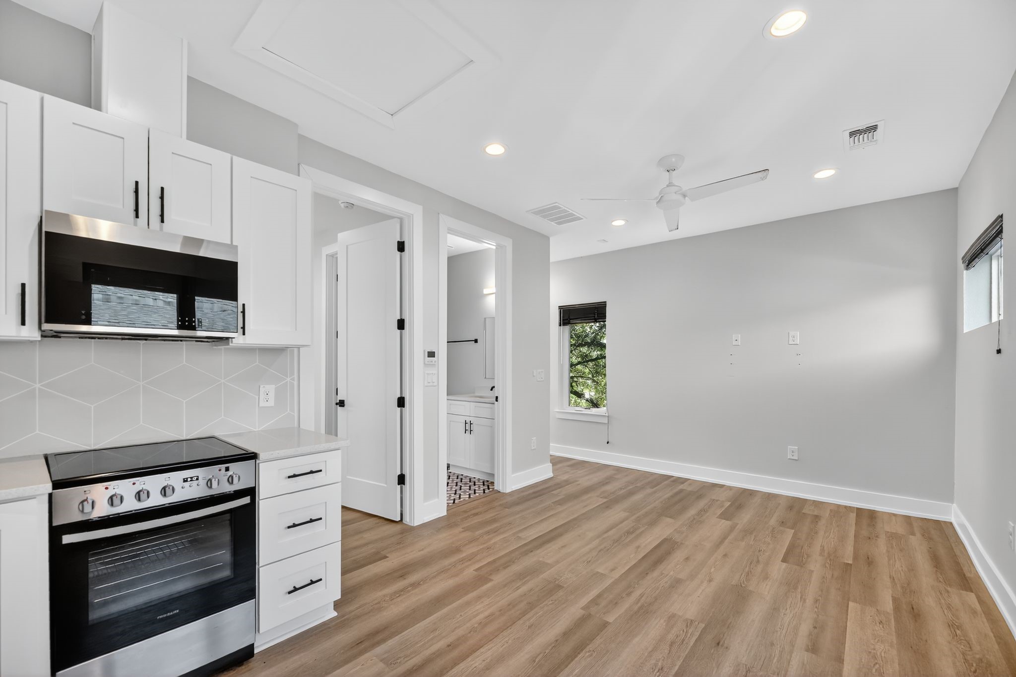 6107 Palm Circle Austin, TX 78741 - Photo 22 of 30 a kitchen with stainless steel appliances a stove and a refrigerator