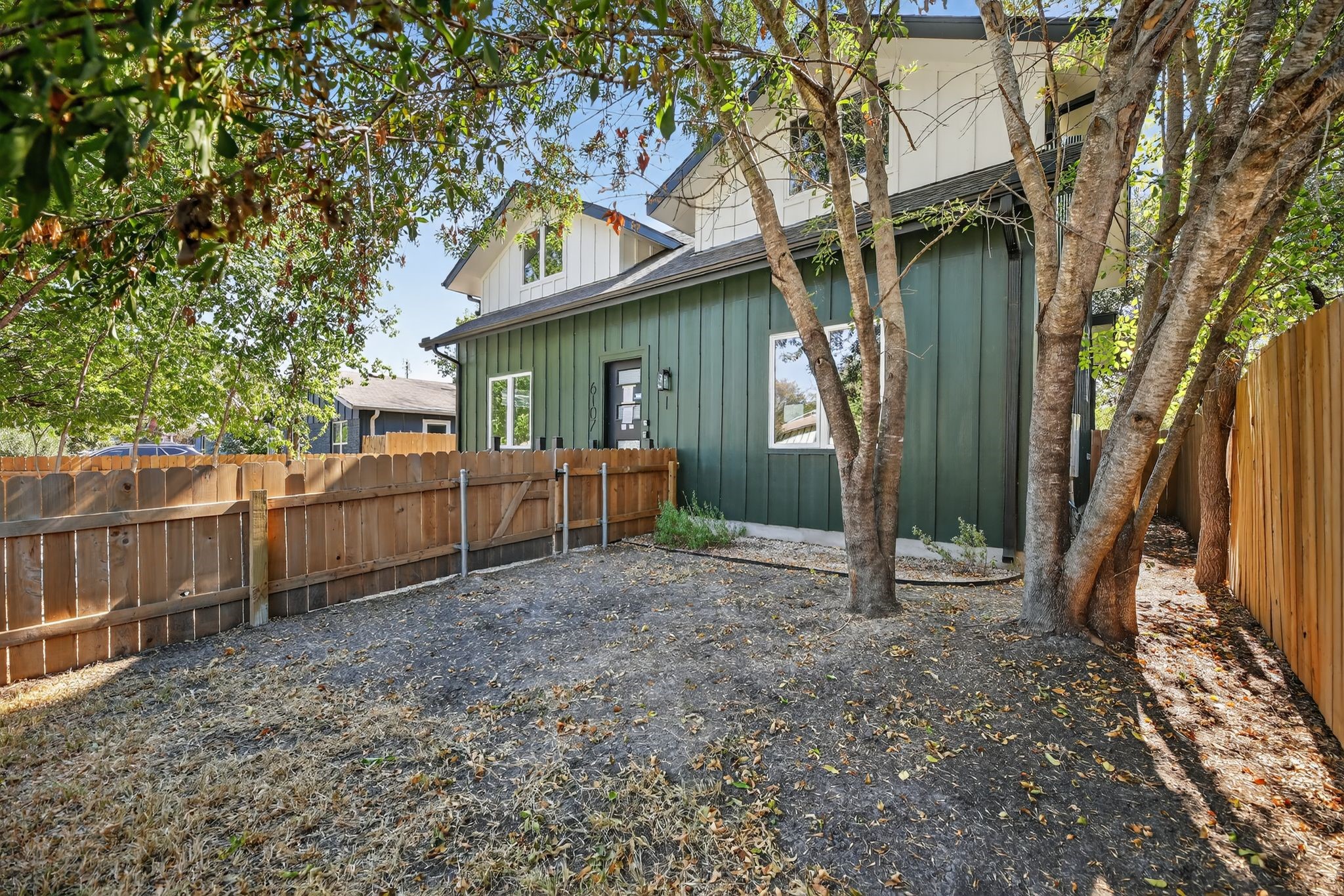 6107 Palm Circle Austin, TX 78741 - Photo 30 of 30 a view of a house with a small yard and wooden fence