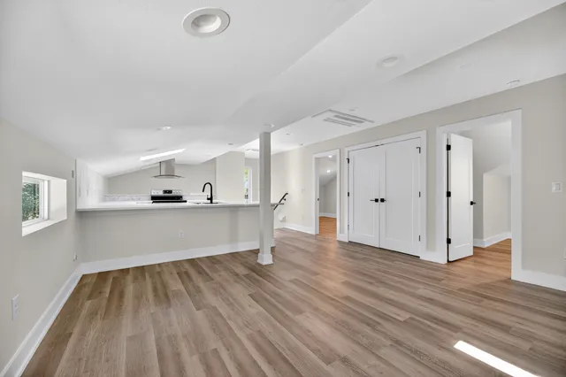 a view of kitchen with wooden floor and window