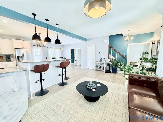 a kitchen with granite countertop a sink and a stove