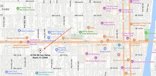 a view of a hallway view with wooden floor and staircase