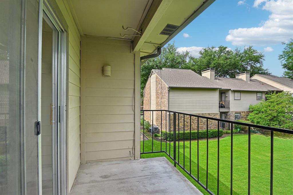 5300 Keller Springs Road, Unit 2055 Dallas, TX 75248 - Photo 21 of 24 Private balcony with concrete flooring, black metal railing, and siding exterior
