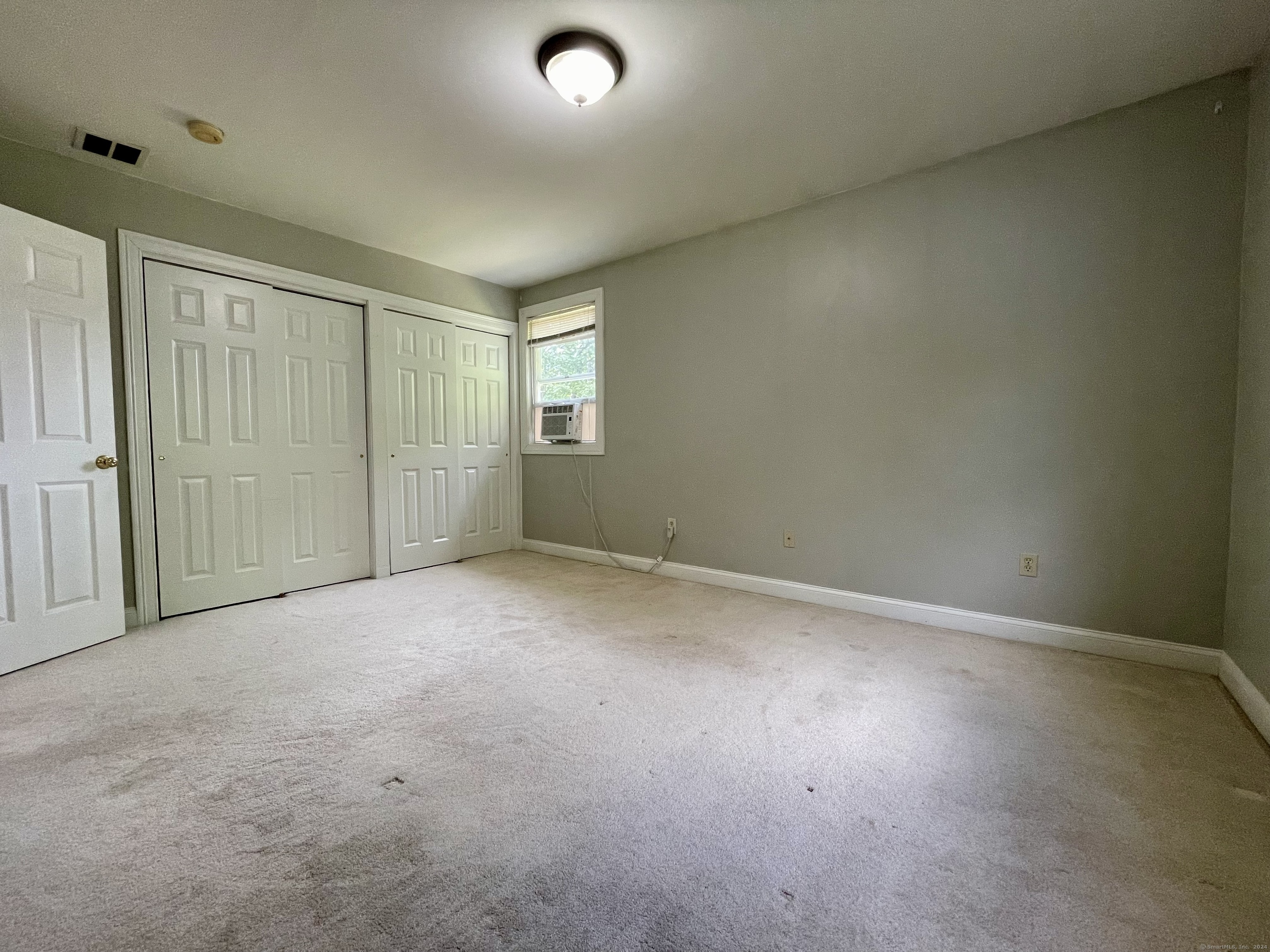70 Grimes Road Rocky Hill, CT 06067 - Photo 15 of 23 an empty room with windows