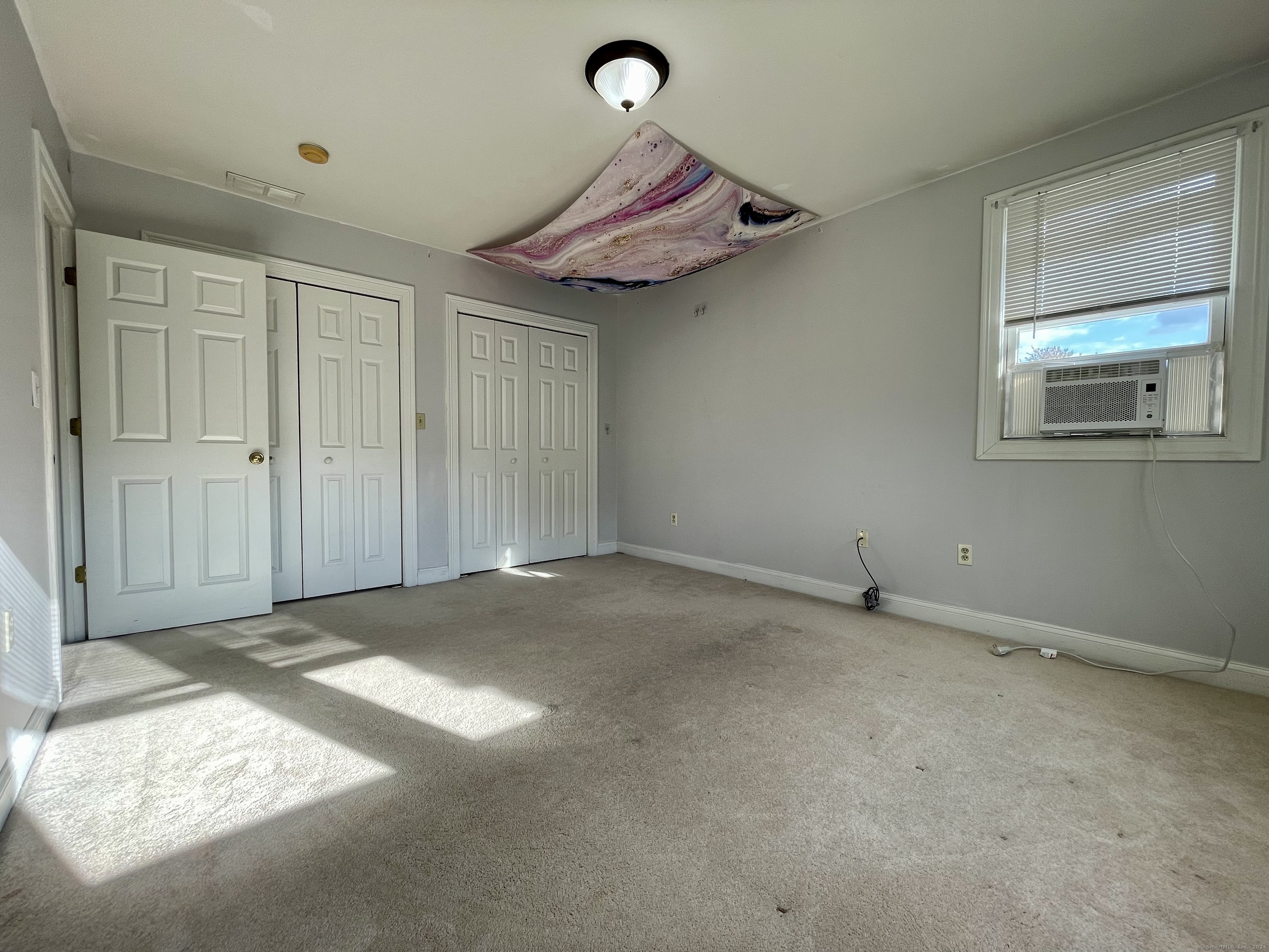 70 Grimes Road Rocky Hill, CT 06067 - Photo 17 of 23 a view of a livingroom with a chandelier fan and window