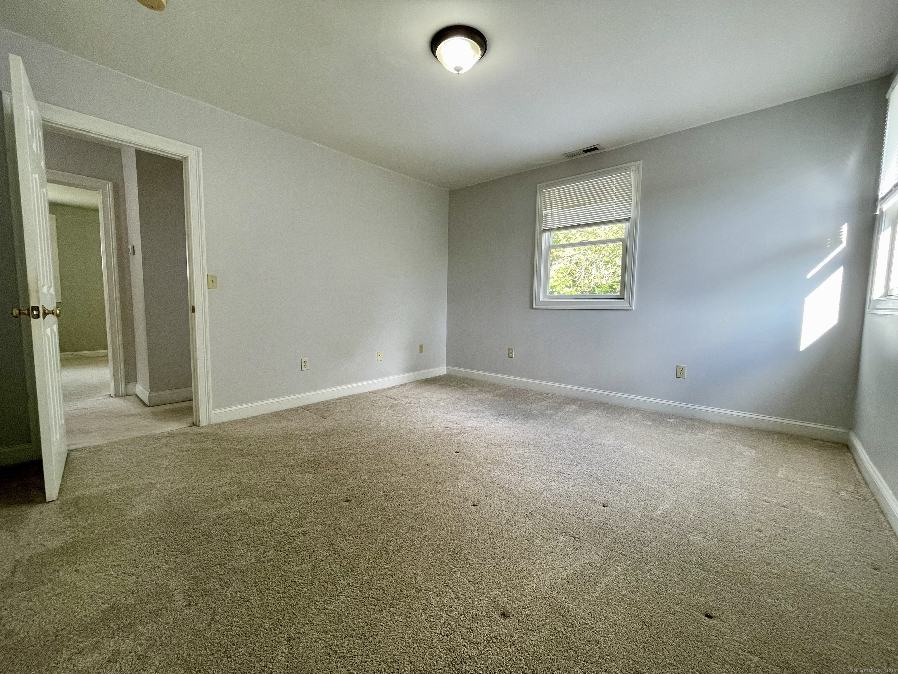 70 Grimes Road Rocky Hill, CT 06067 - Photo 19 of 23 an empty room with windows
