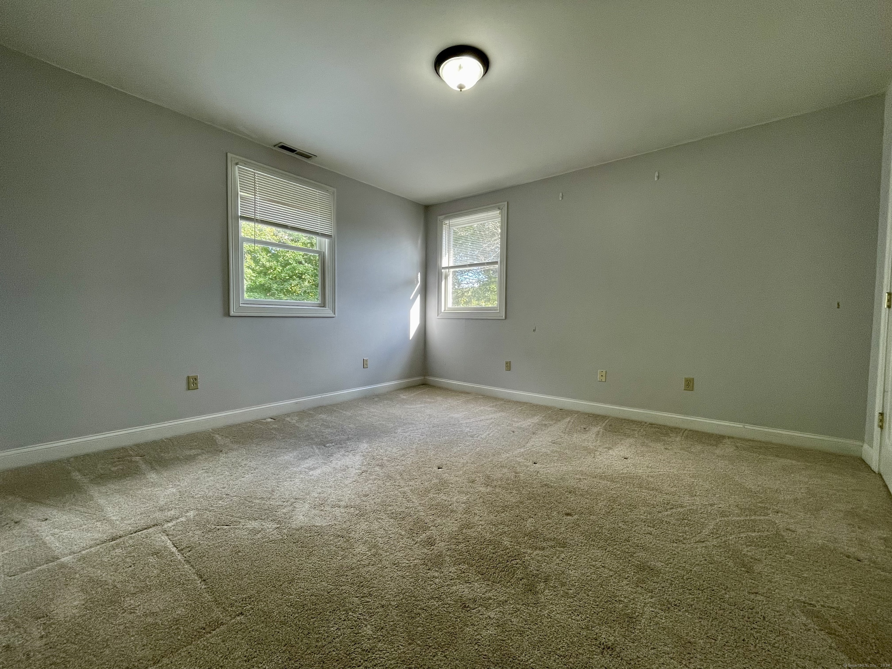70 Grimes Road Rocky Hill, CT 06067 - Photo 20 of 23 an empty room with windows