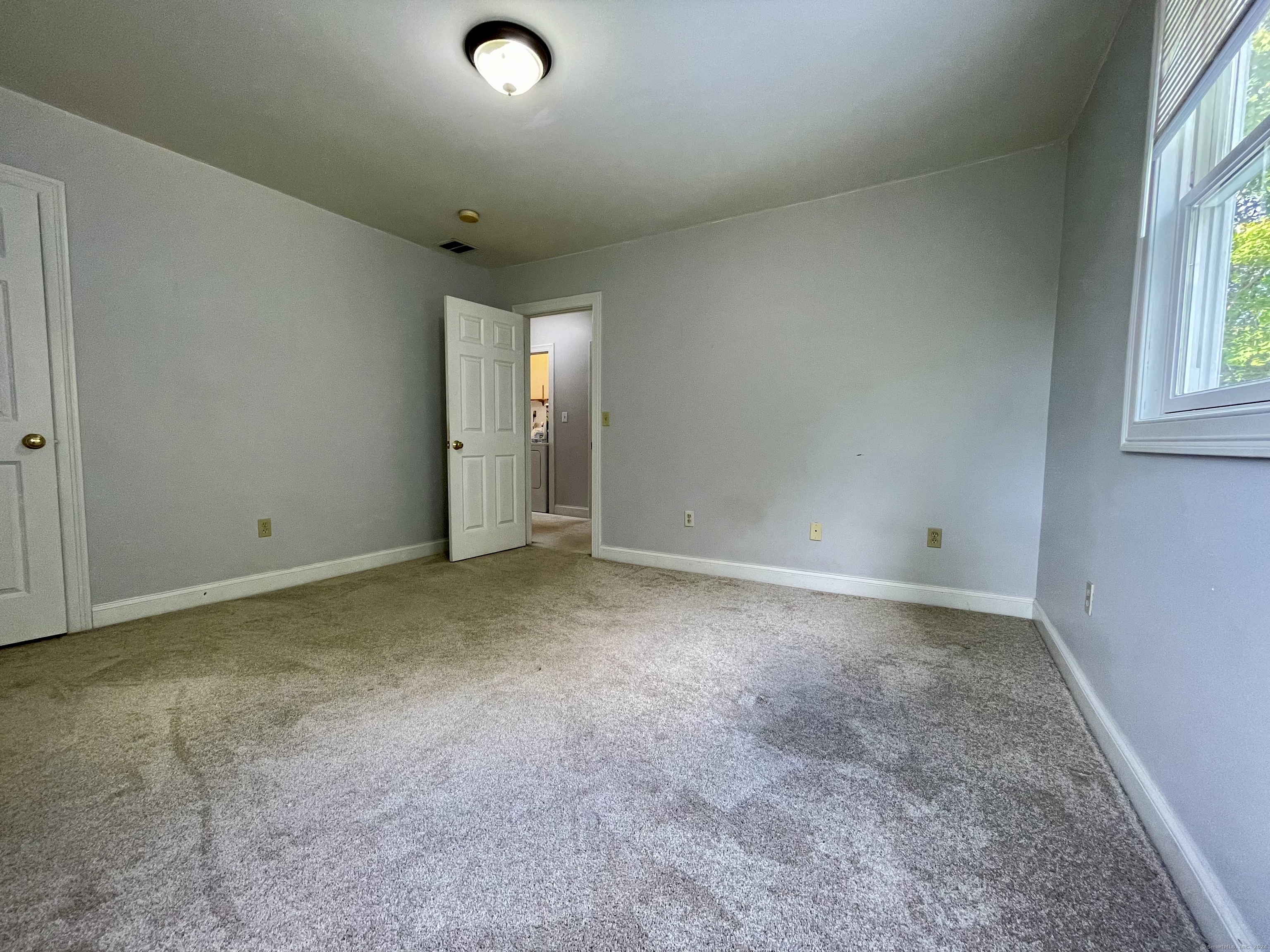 70 Grimes Road Rocky Hill, CT 06067 - Photo 21 of 23 an empty room with windows and closet