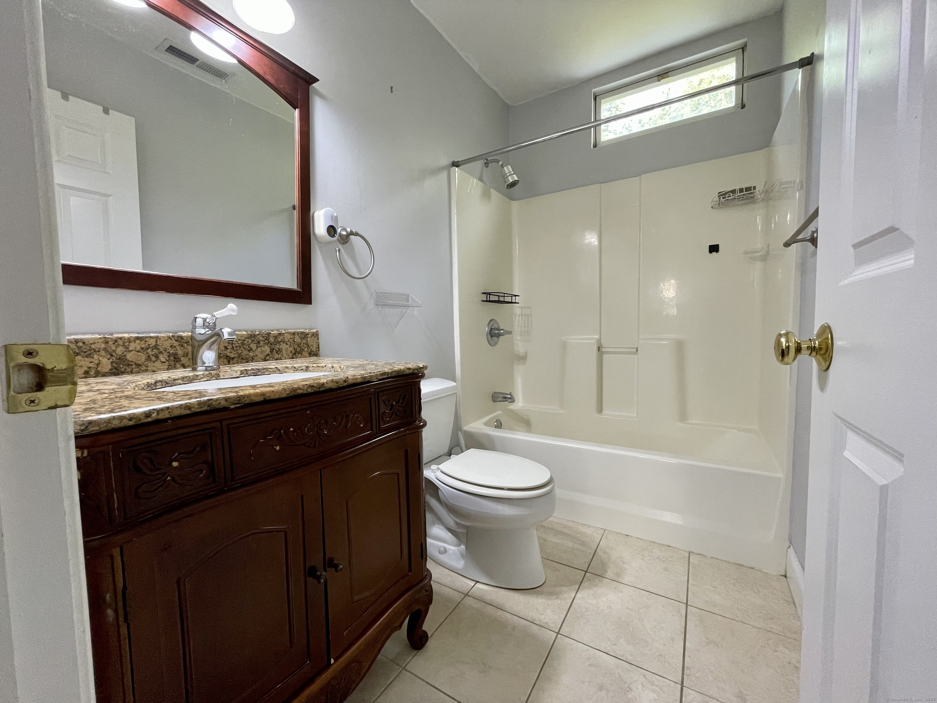 70 Grimes Road Rocky Hill, CT 06067 - Photo 22 of 23 a bathroom with a sink a toilet and shower