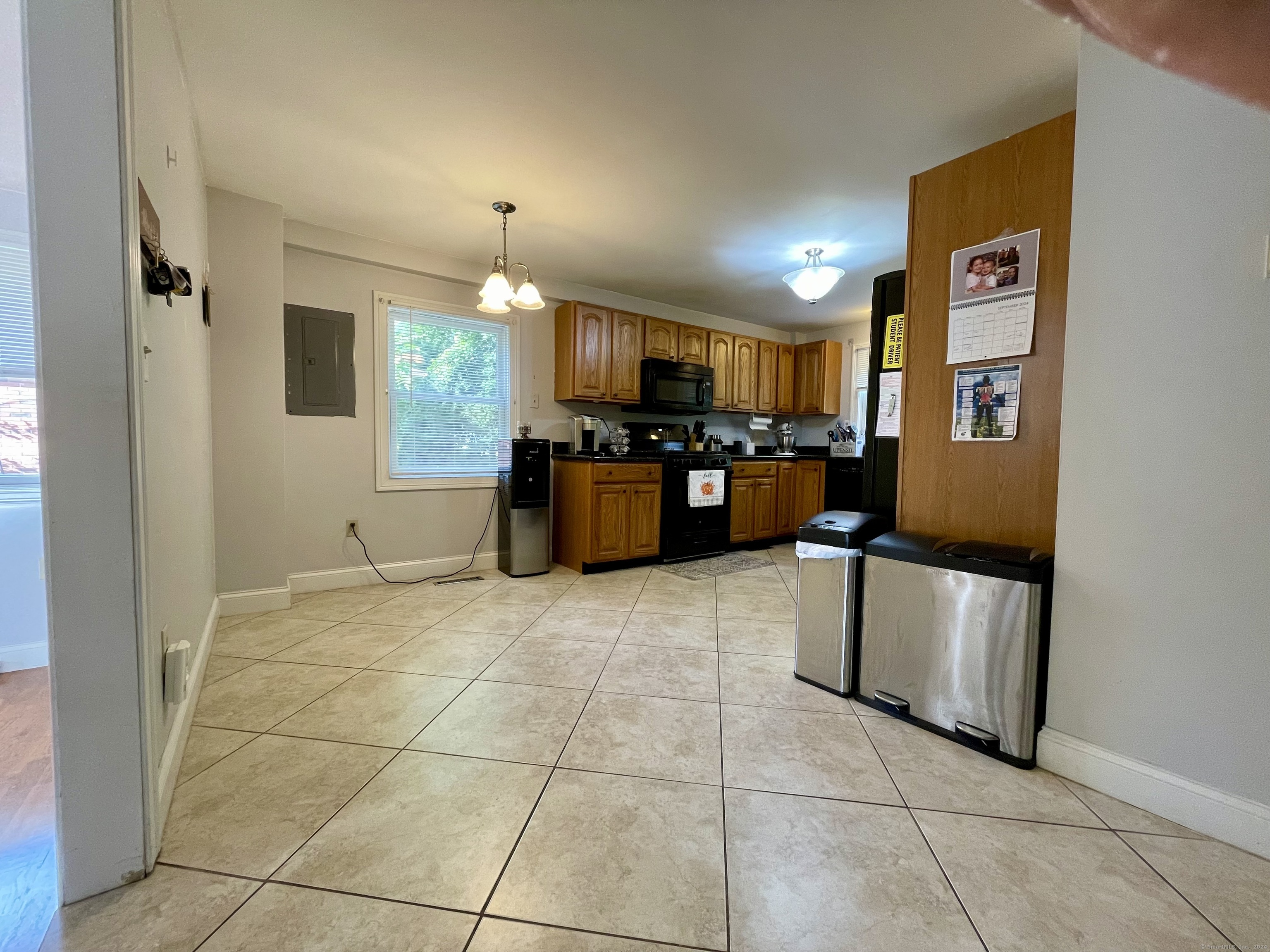 70 Grimes Road Rocky Hill, CT 06067 - Photo 3 of 23 a kitchen with stainless steel appliances granite countertop a refrigerator and a stove top oven