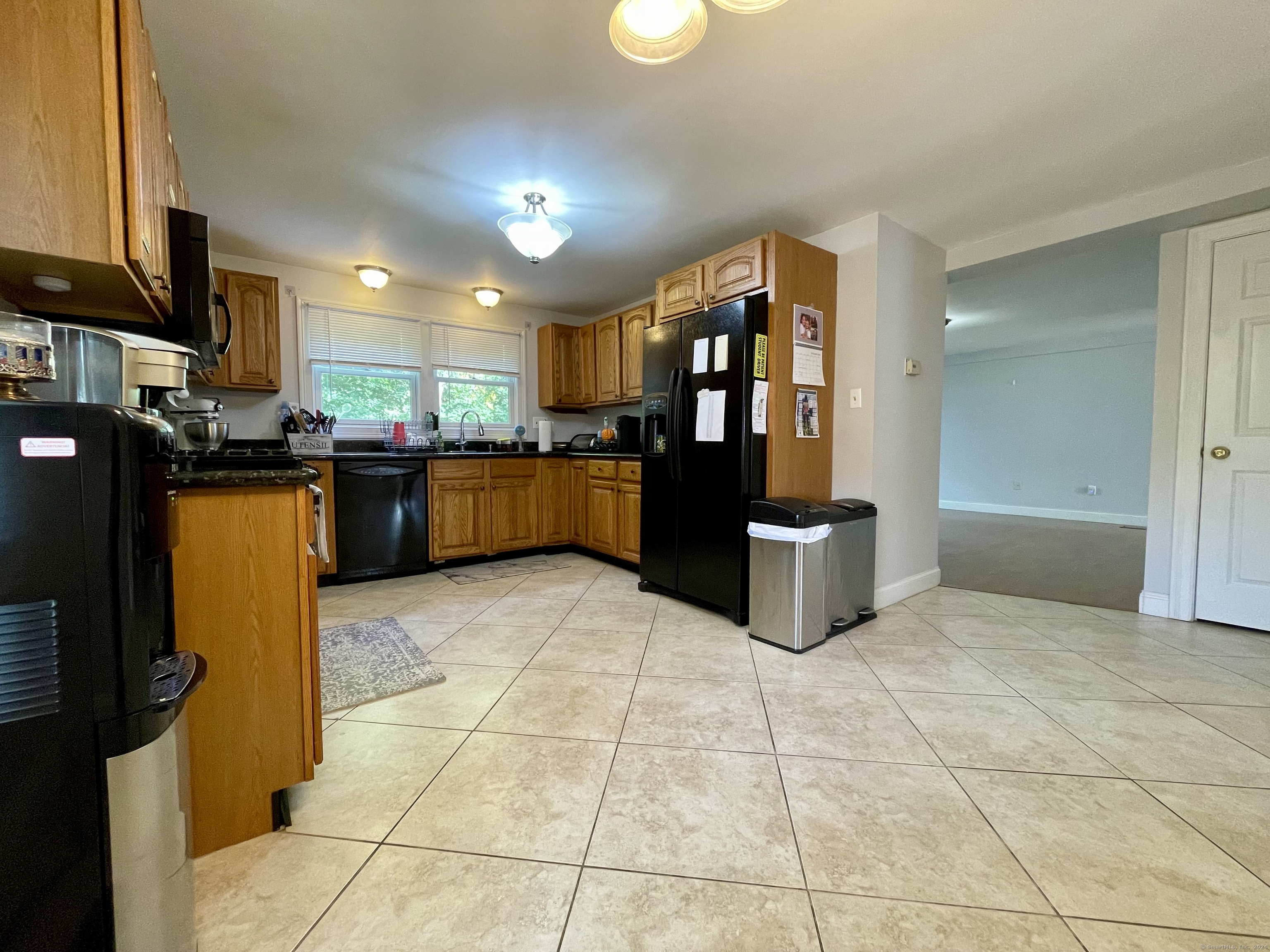 70 Grimes Road Rocky Hill, CT 06067 - Photo 4 of 23 a kitchen with stainless steel appliances granite countertop a refrigerator and a stove