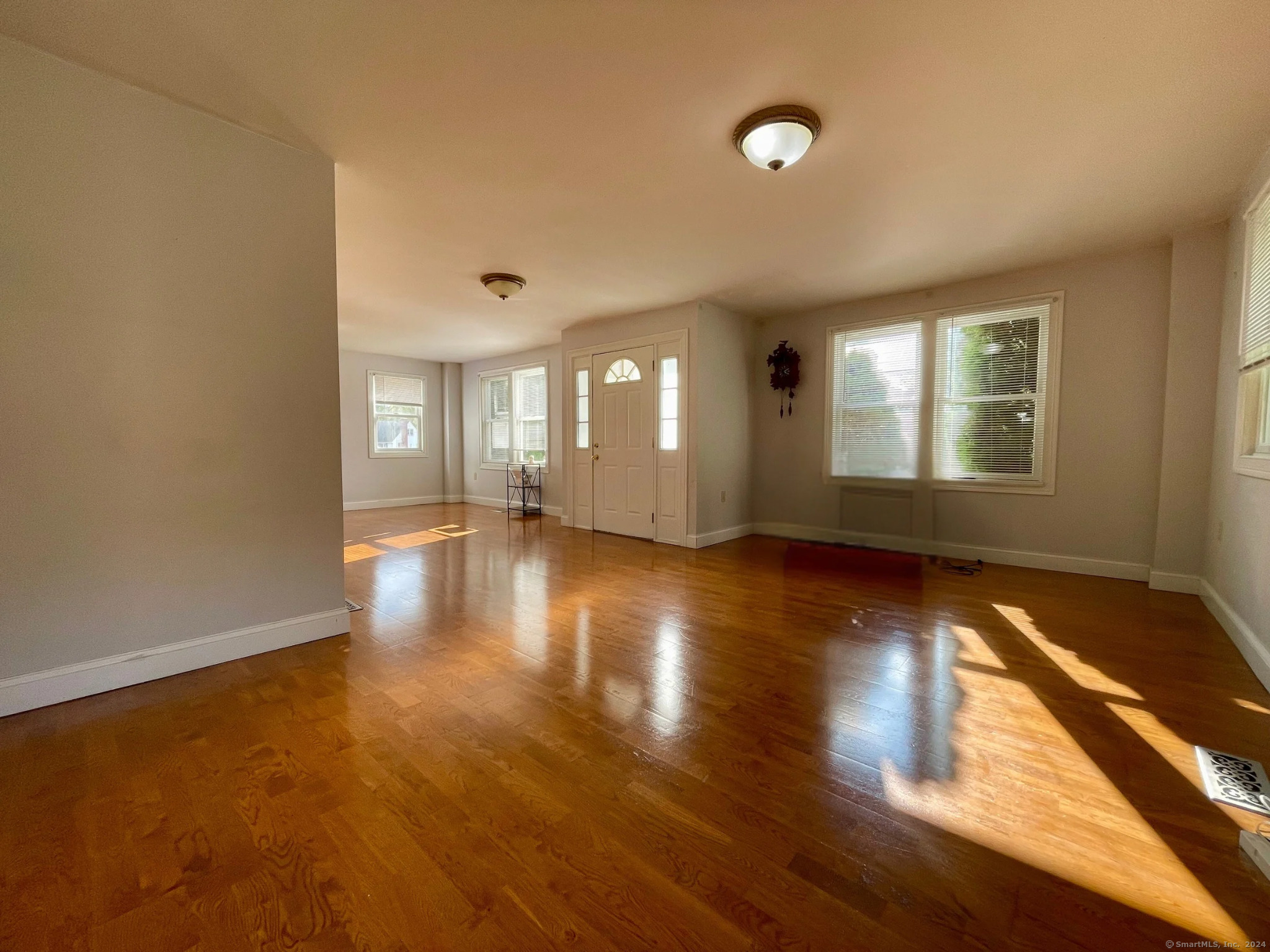 70 Grimes Road Rocky Hill, CT 06067 - Photo 5 of 23 an empty room with wooden floor and windows