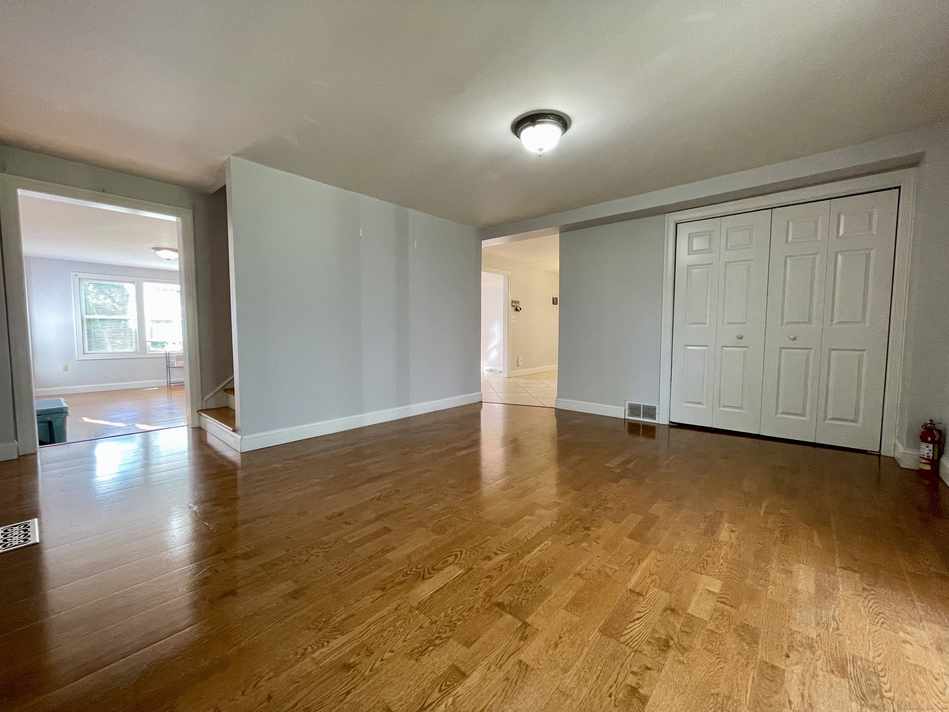 70 Grimes Road Rocky Hill, CT 06067 - Photo 9 of 23 wooden floor in an empty room with a window