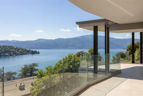 a view of a terrace with a garden and lake view