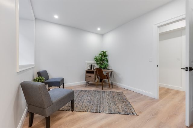 a living room with furniture and a table
